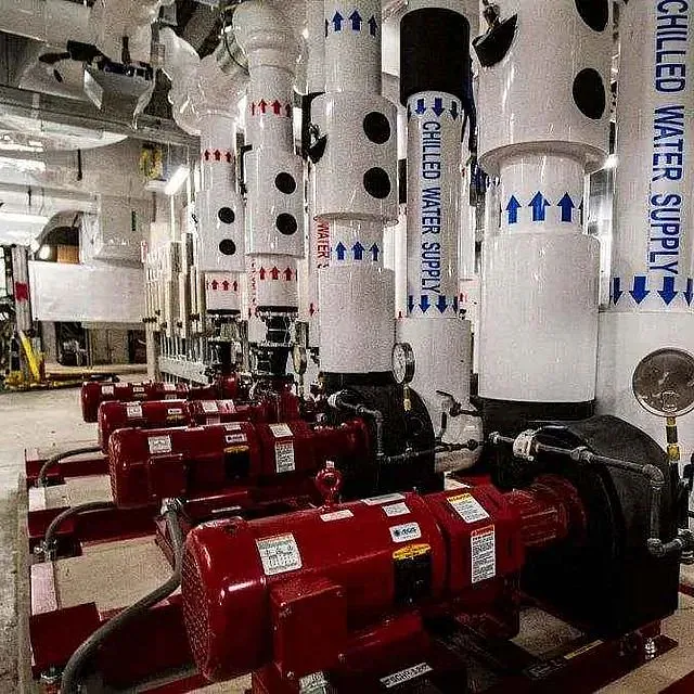Water pumps and pipes in a room at a New Construction Project, Midwest Medical Facility, Chicago, IL