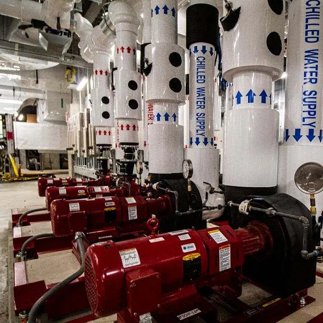 A group of pipes and valves arranged in a mechanical room in Chicago, IL. 