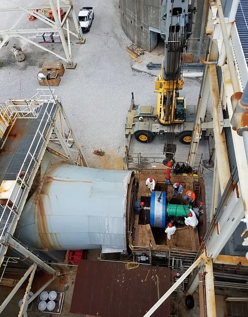 A team of workers servicing a large industrial booster fan in Chicago, IL