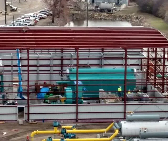 Industrial facility featuring a large tank and pipes, located in Chicago, IL